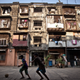 The courtyard of the BDD chawl. Constructed in 1922 as jails, the chawls eventually became homes for the mill workers. As the years went on, families grew and residents tried to expand to make more room (the white and red makeshift balconies in the picture for example).